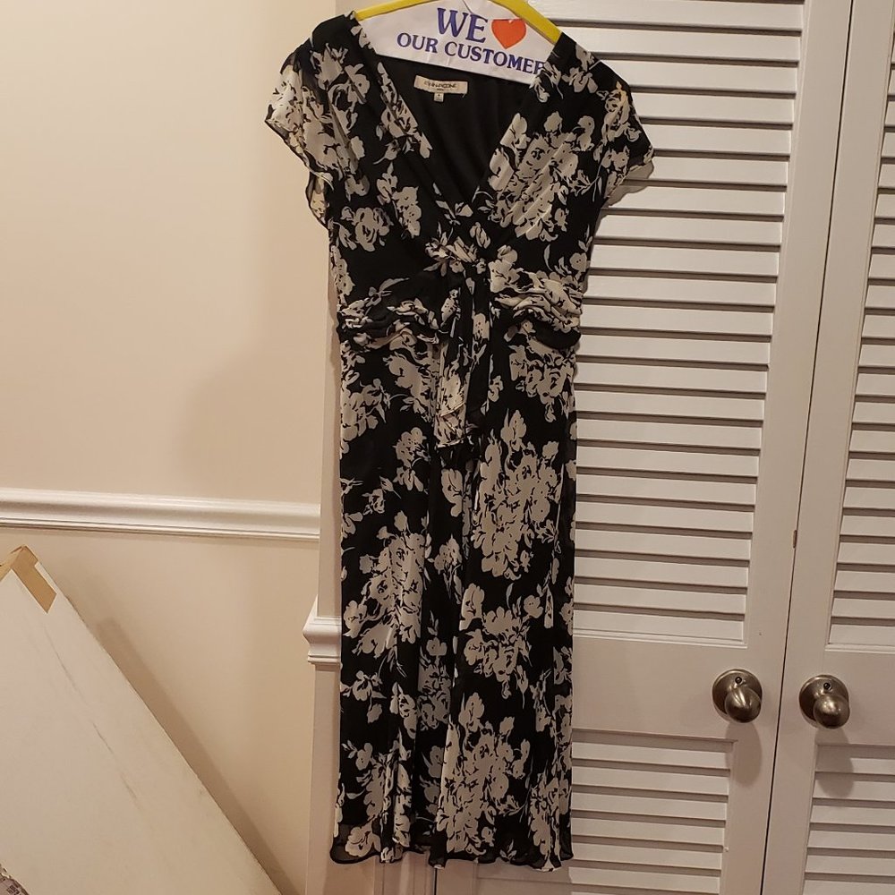 Monochrome midi  dress with underlying slip and flutter sleeves.